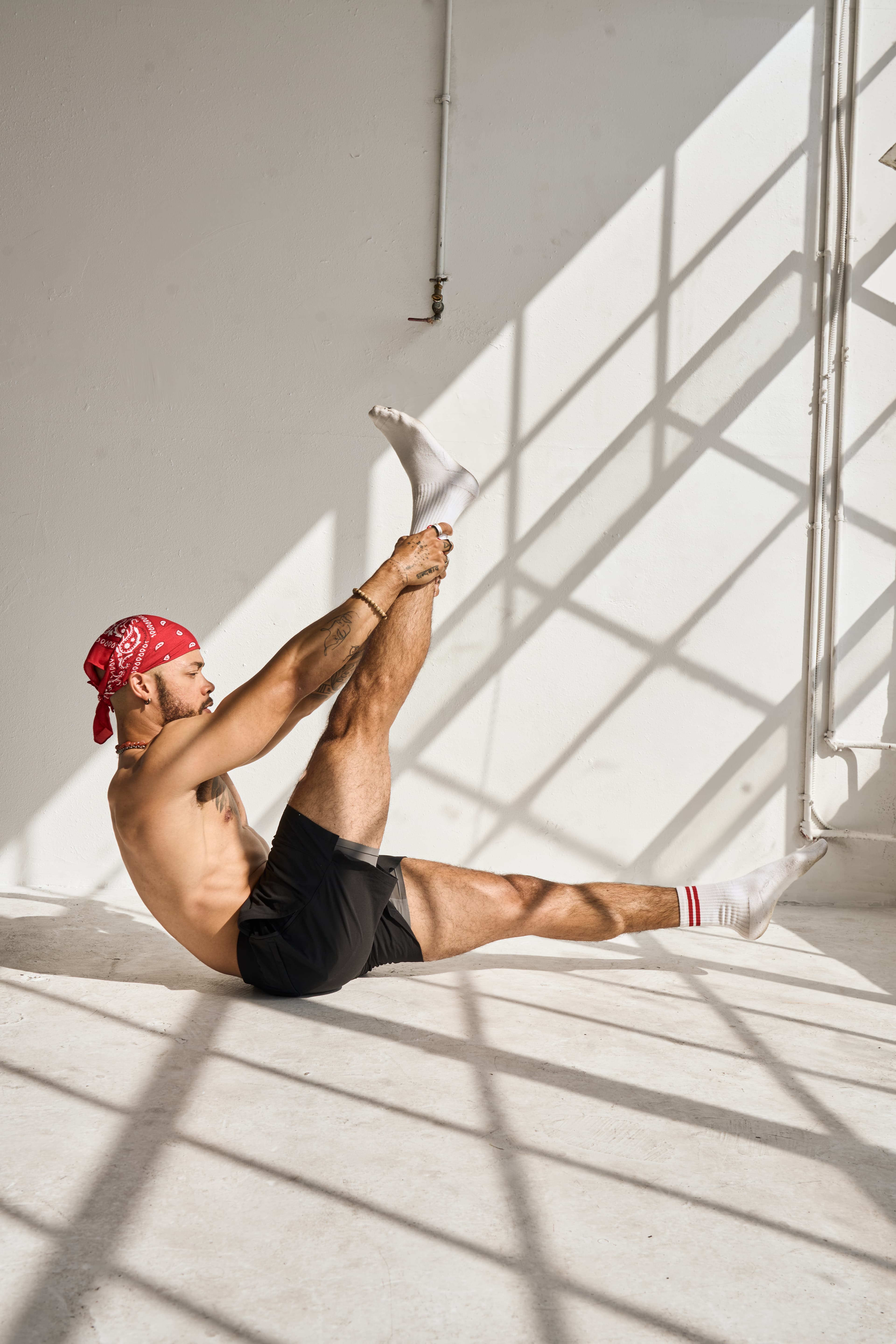 Greg performing a Pilates mat pose